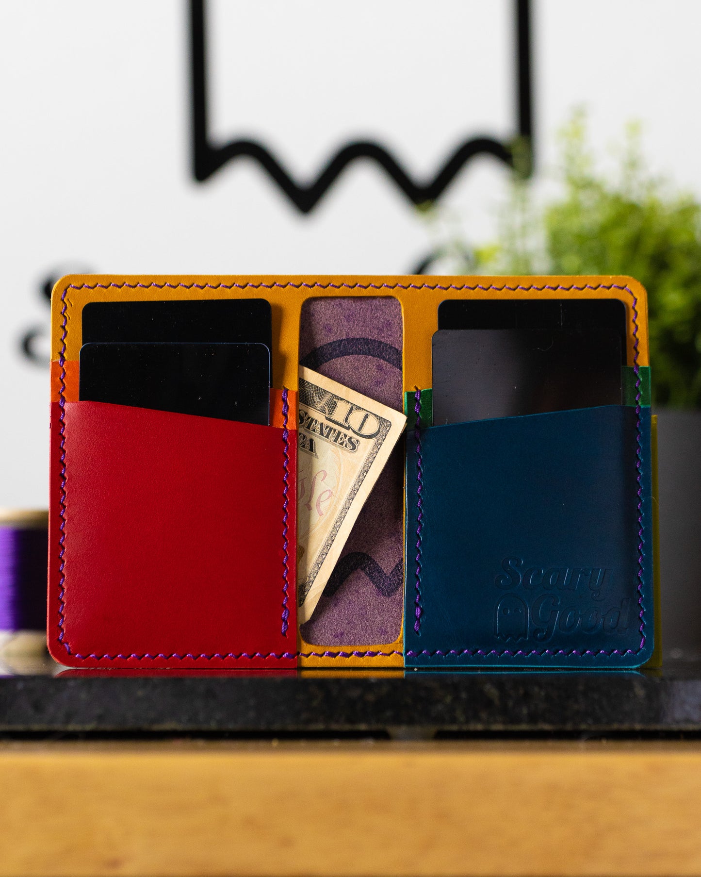 SLASHR Wallet Pride Edition with card and cash inserted