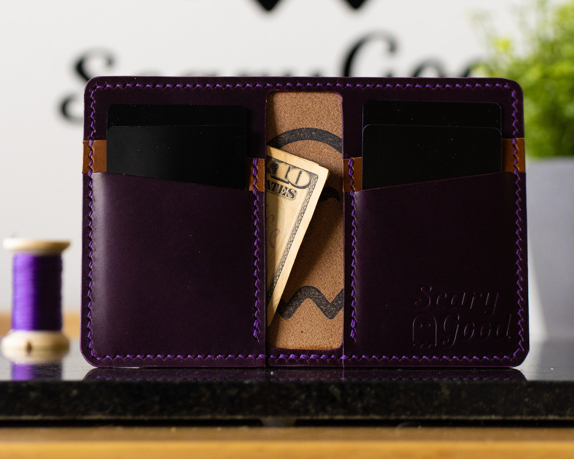 SLASHR Wallet Violet and Cognac with cards and cash inserted